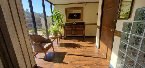 TILE ENTRY AND RECEPTION, 3 OFFICES AND LARGER ROOM.